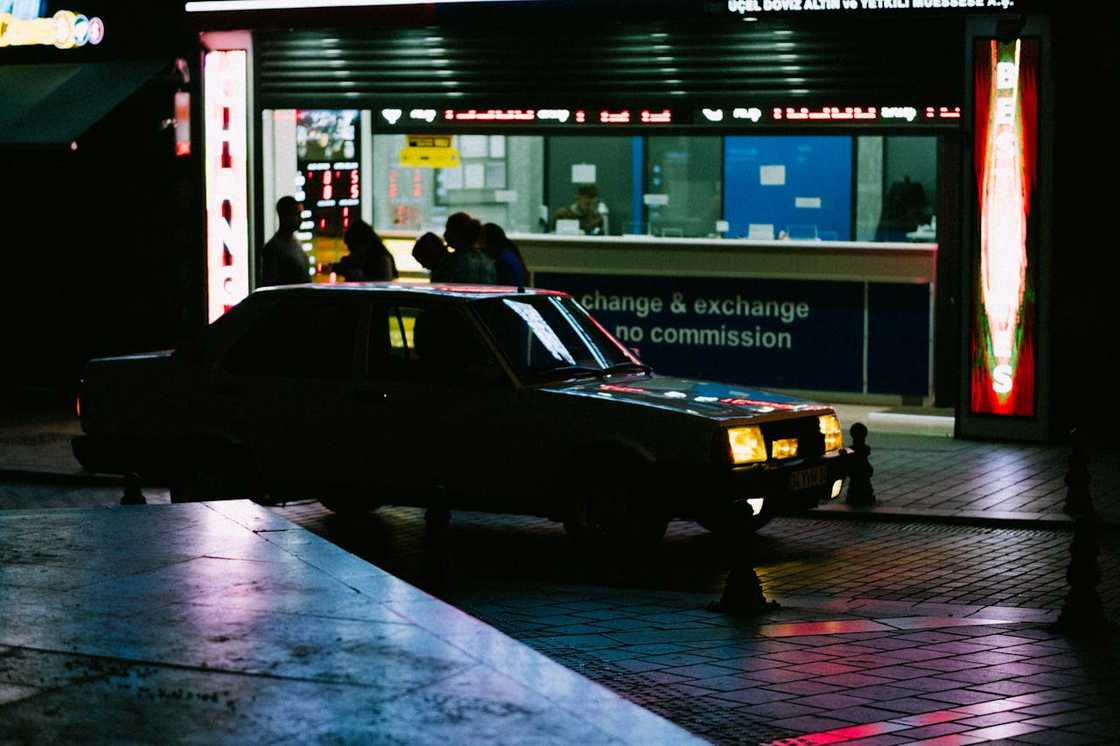 A car moving in the city at night.
