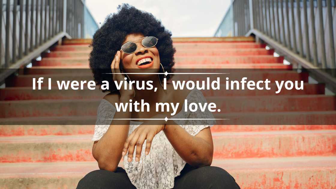 A woman with Afro hair and sunglasses is pictured laughing A woman with Afro hair and sunglasses is pictured laughing