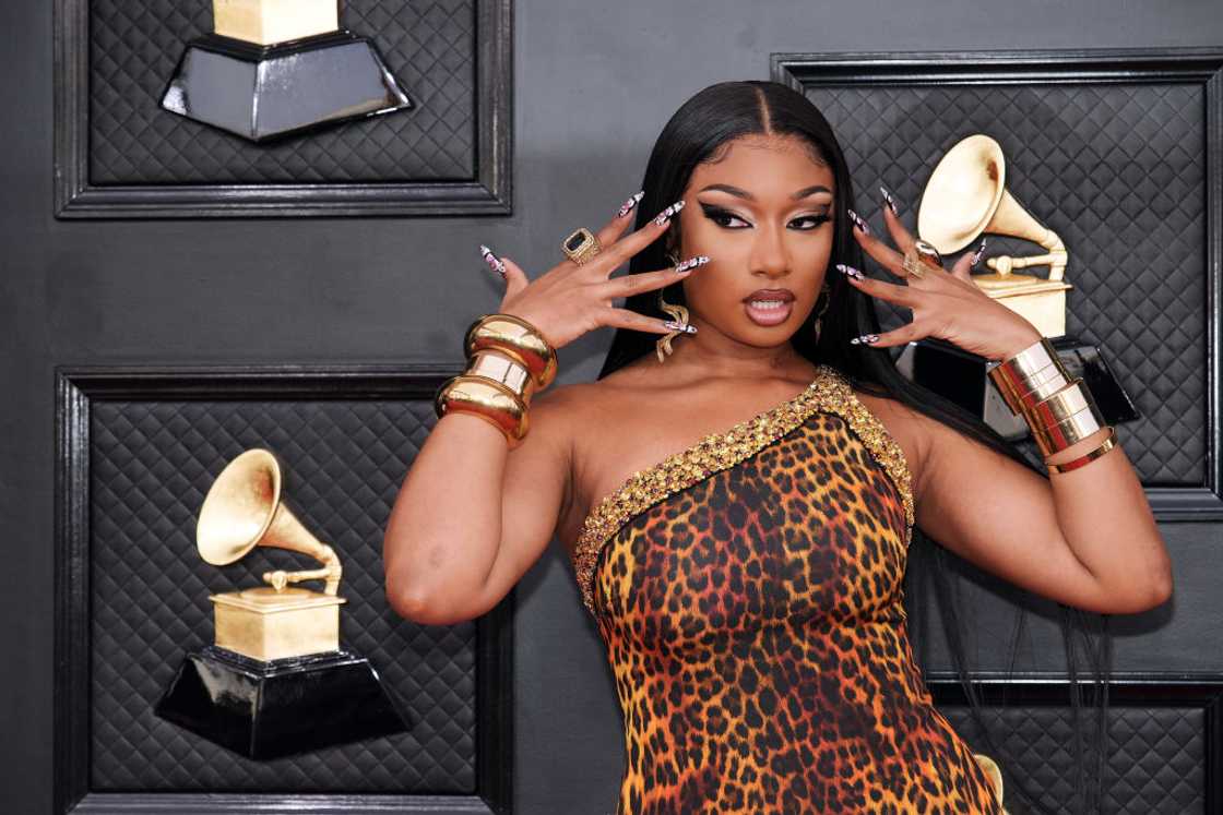 Megan Thee Stallion pose at the 64th Annual Grammy Awards