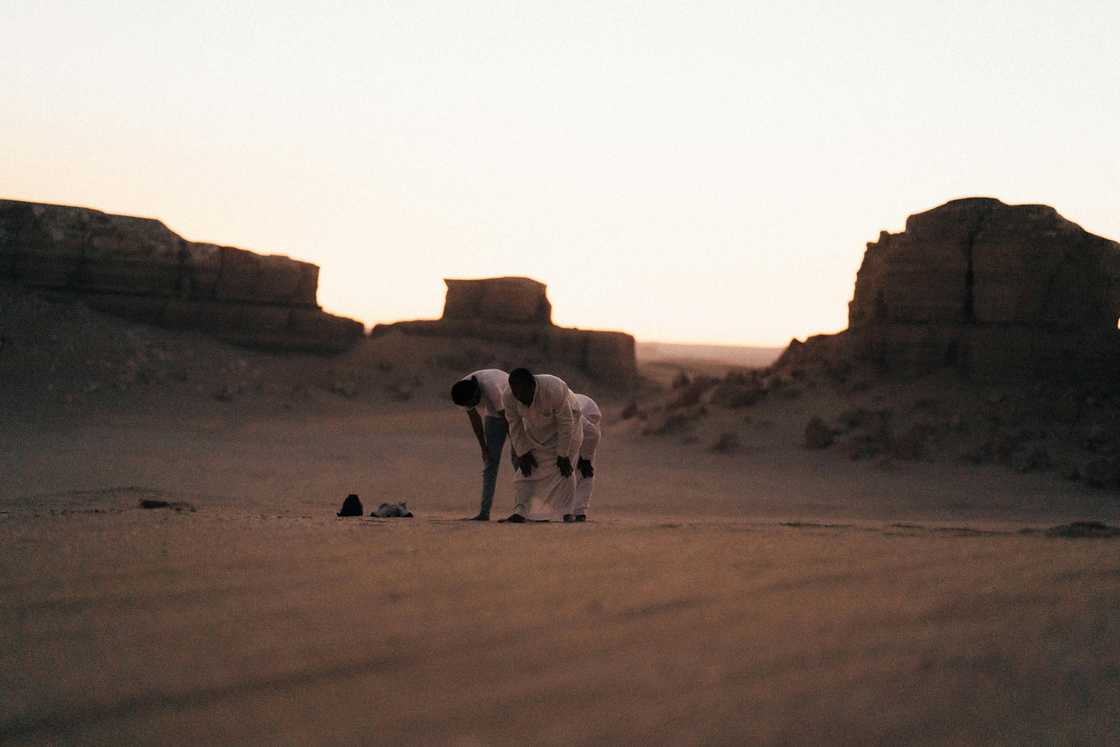 Muslims praying in the desert Muslims praying in the desert
