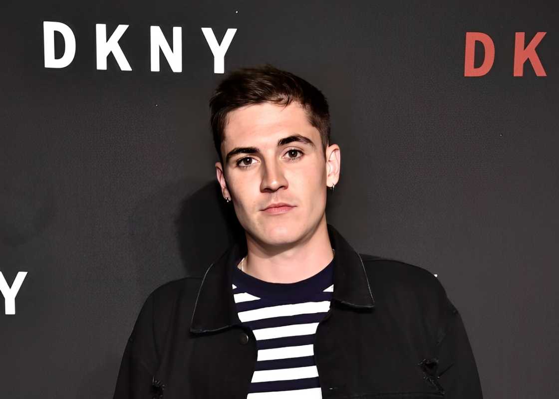 Sammy Wilk posing at the DKNY 30th Anniversary party