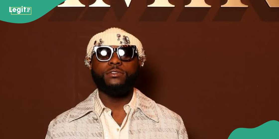 Davido seen being held by men after he alleged clashed with a fan on stage