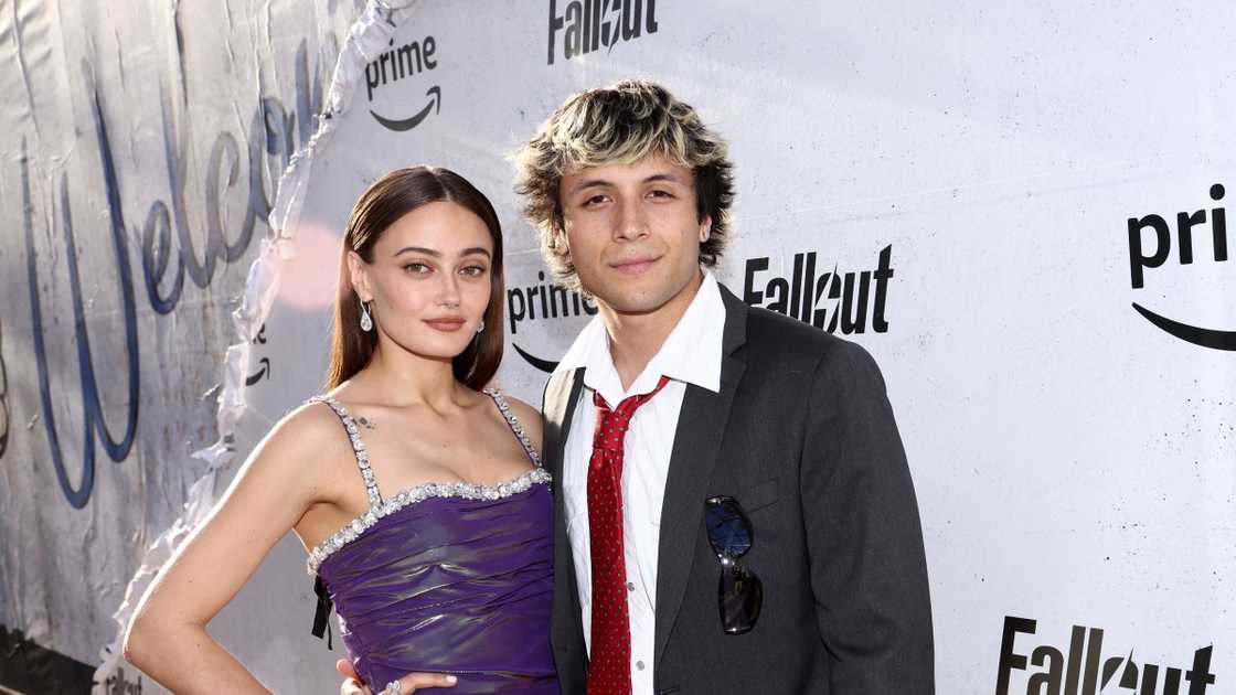 Ella Purnell and Max Bennett Kelley pose on the red carpet during a movie premiere.