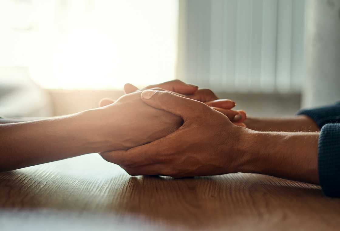 A man and woman holding hands