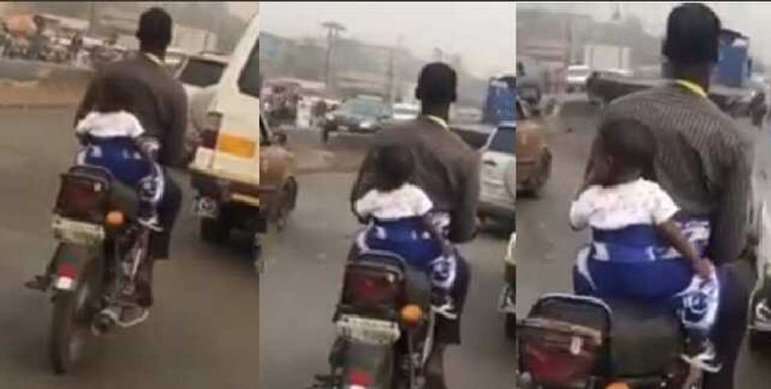 Okada man seen cruising on his bike with his baby on his back Okada man seen cruising on his bike with his baby on his back