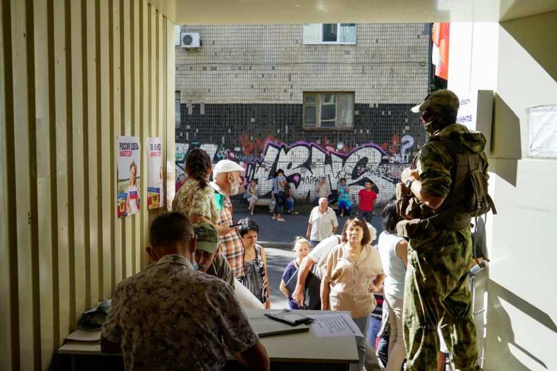 Residents apply for Russian citizenship in Kherson last month Residents apply for Russian citizenship in Kherson last month