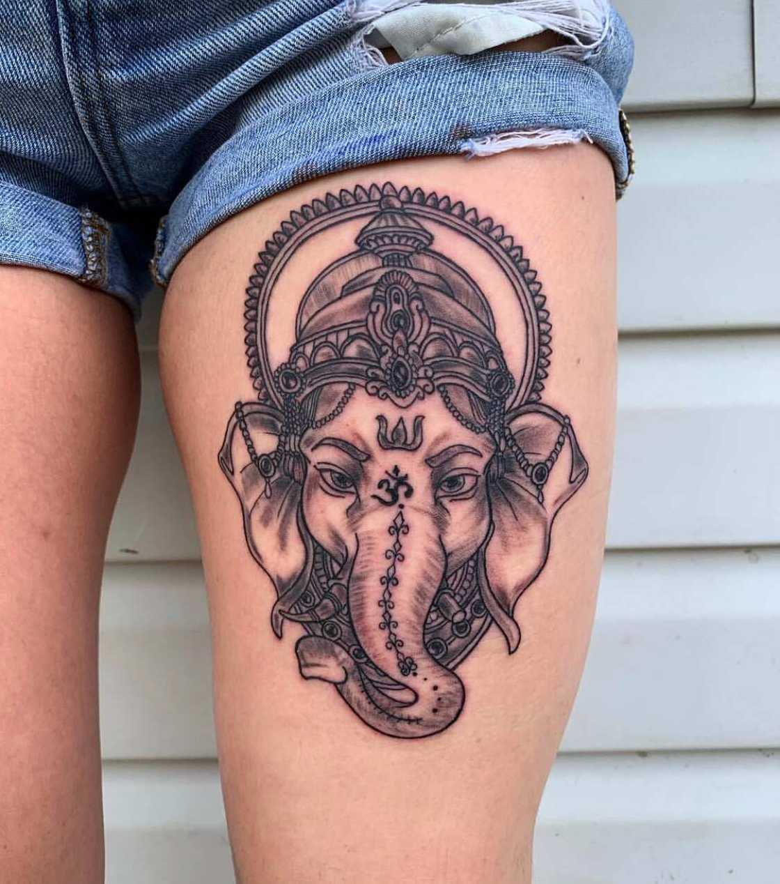 Elephant thigh tattoo