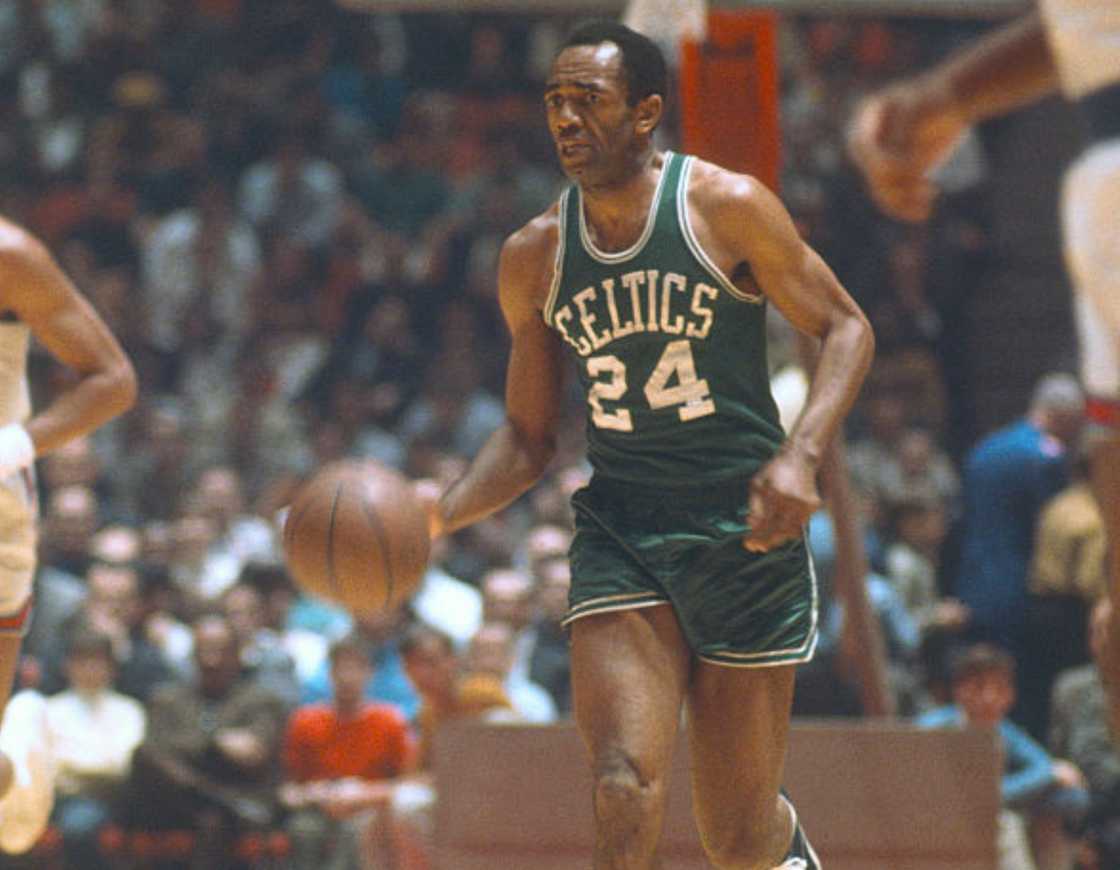 Sam Jones dribbles the ball upcourt against the Philadelphia 76ers in 1965