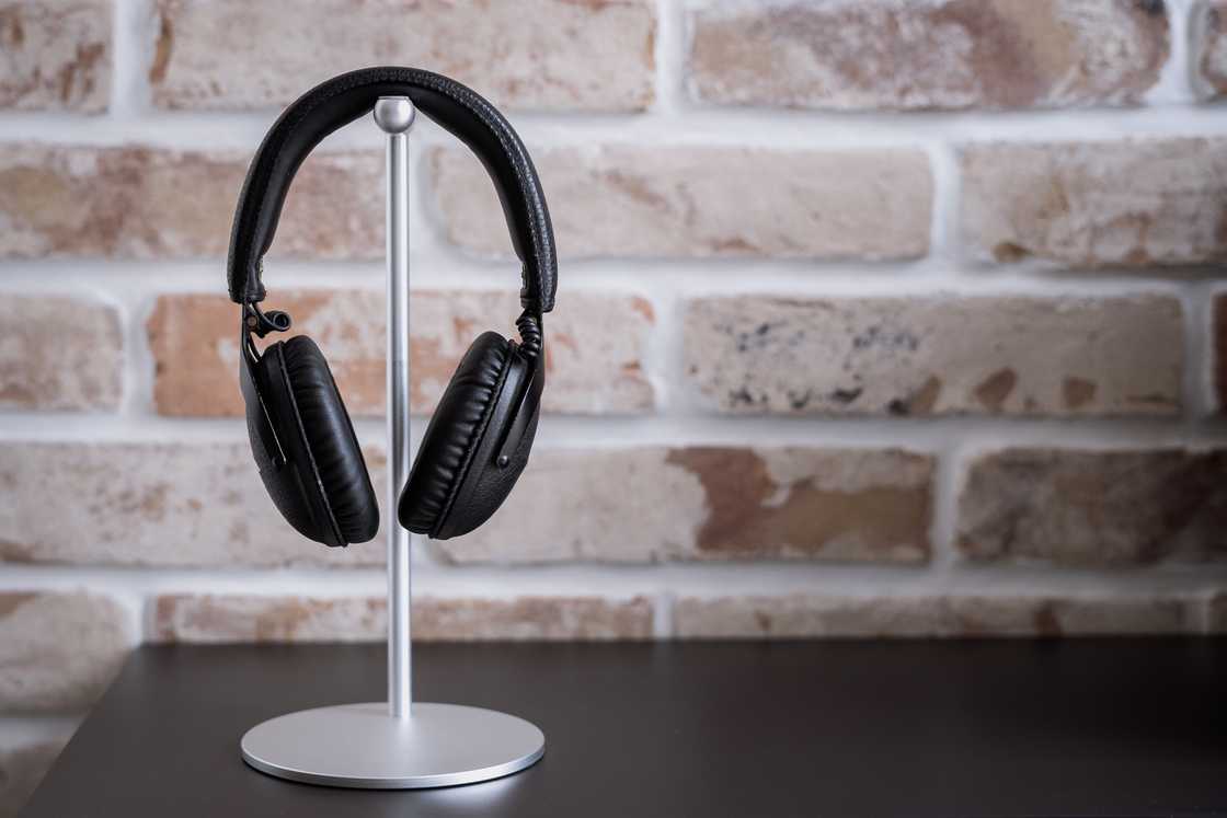 Black headphones to stand against brick wall. Black headphones to stand against brick wall.