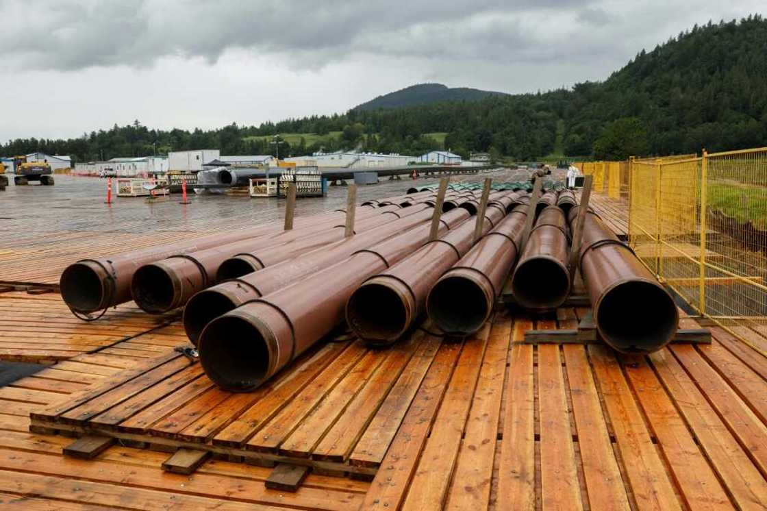 The Trans Mountain pipeline, whose pieces are seen here at a storage lot in Abbotsford, Canada in June 2021 waiting to be assembled, is no longer profitable, the office of the Parliamentary Budget Officer concluded in a report The Trans Mountain pipeline, whose pieces are seen here at a storage lot in Abbotsford, Canada in June 2021 waiting to be assembled, is no longer profitable, the office of the Parliamentary Budget Officer concluded in a report