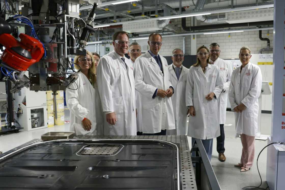 Friedrich Merz (C) has vowed to boost Europe's biggest economy with a debt-fuelled public spending bonanza Friedrich Merz (C) has vowed to boost Europe's biggest economy with a debt-fuelled public spending bonanza