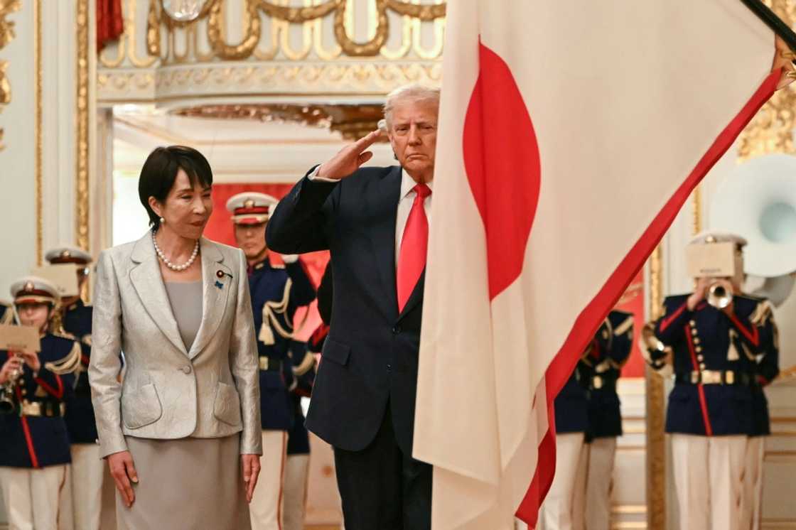 Japan's Prime Minister Sanae Takaichi (L) and US President Donald Trump review an honour guard of the Japan Self-Defense Force at the Akasaka State Guest House in Tokyo on October 28, 2025 Japan's Prime Minister Sanae Takaichi (L) and US President Donald Trump review an honour guard of the Japan Self-Defense Force at the Akasaka State Guest House in Tokyo on October 28, 2025