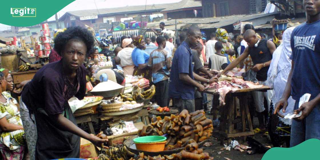 Woman collapses in a Nigerian market