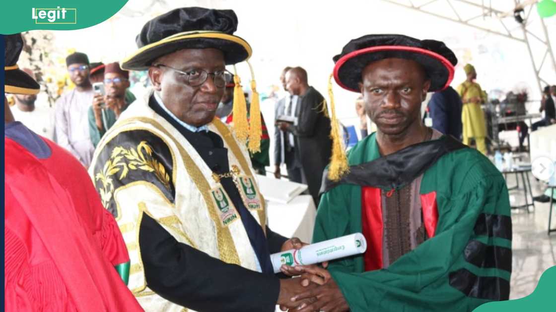 A graduating student receiving their degree