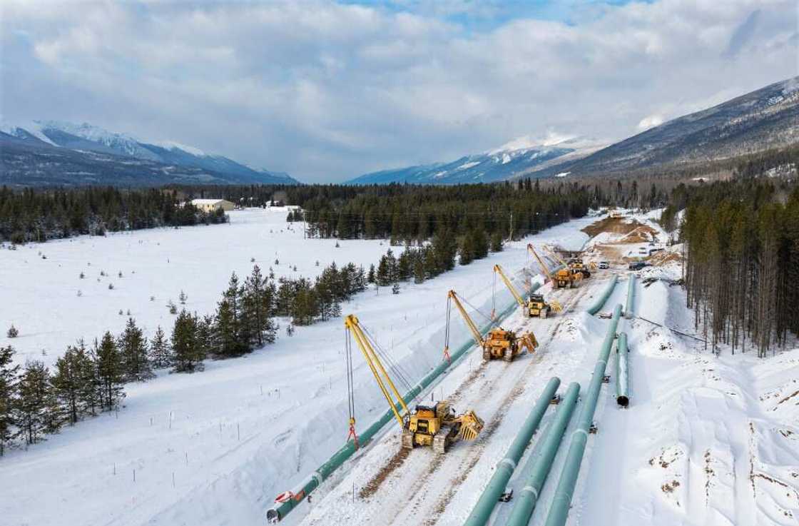 This December 9, 2021, image courtesy of Trans Mountain Corporation shows winter pipeline construction work in Valemount, British Columbia, Canada. The first major new pipeline to be built in Canada in decades is set to open on May 1 This December 9, 2021, image courtesy of Trans Mountain Corporation shows winter pipeline construction work in Valemount, British Columbia, Canada. The first major new pipeline to be built in Canada in decades is set to open on May 1