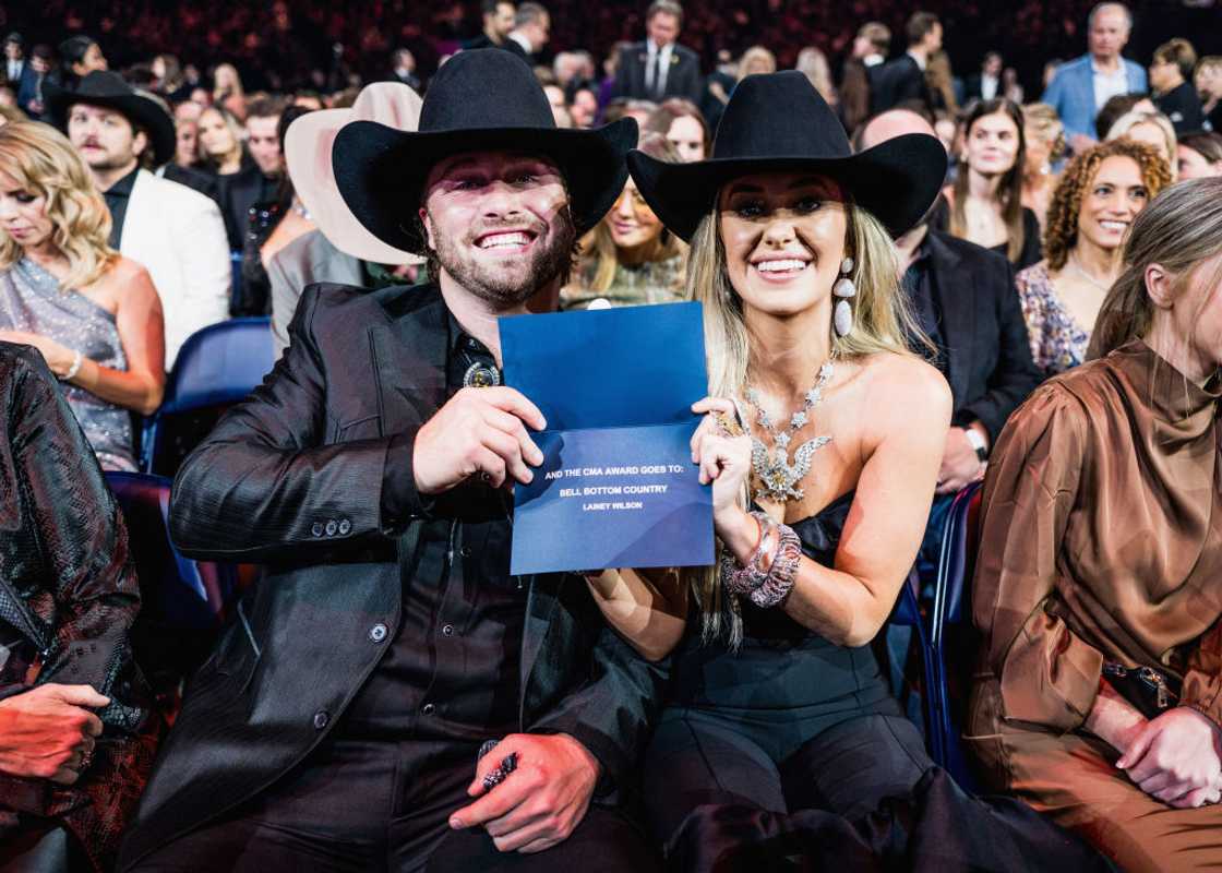 Lainey Wilson and Devlin "Duck" Hodges celebrates her win at at the 57th Annual Country Music Association Awards