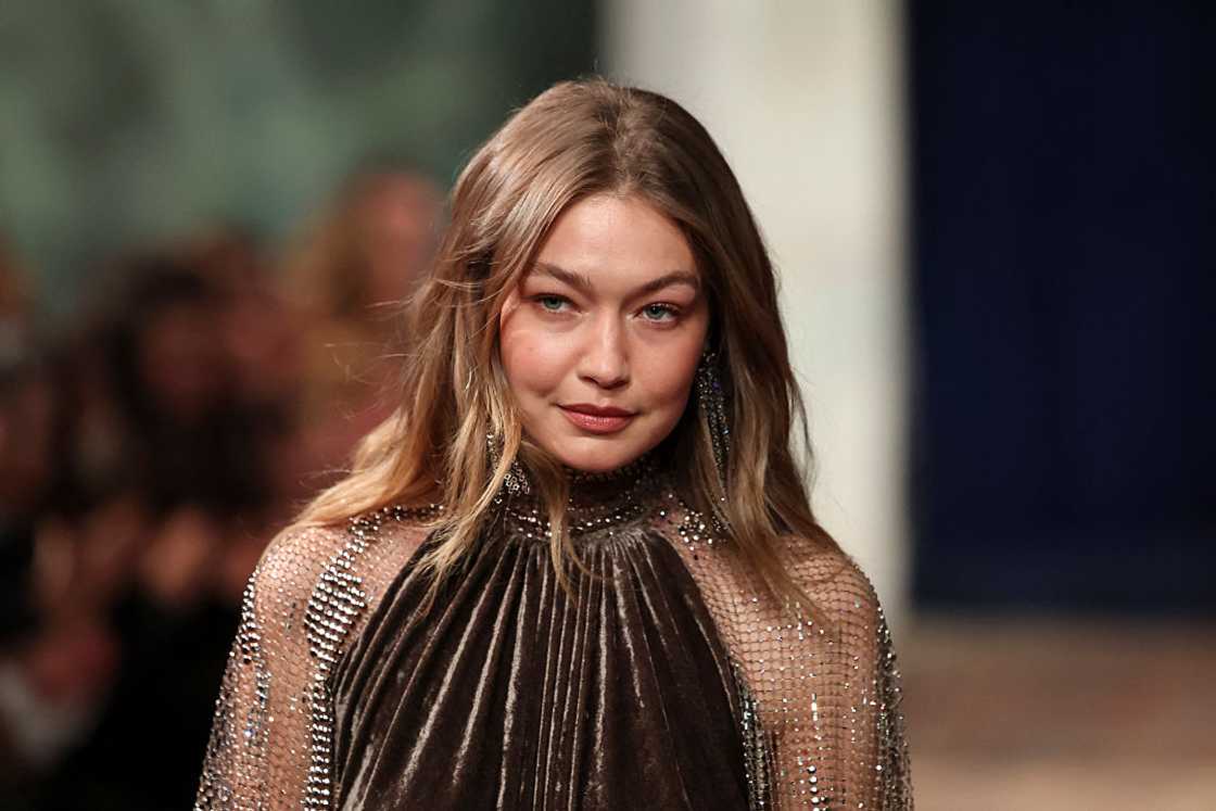 Gigi Hadid walks the runway during a fashion event