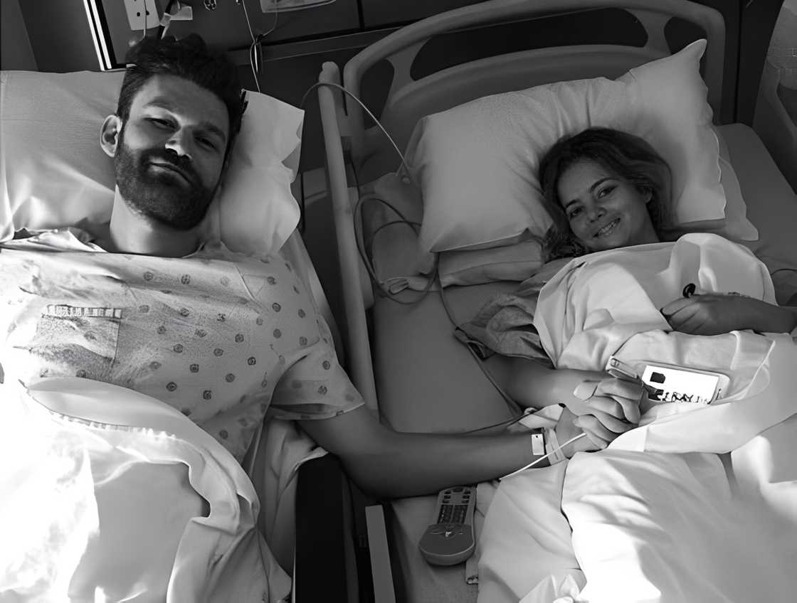 Bijou Phillips and her living donor hold hands across hospital beds