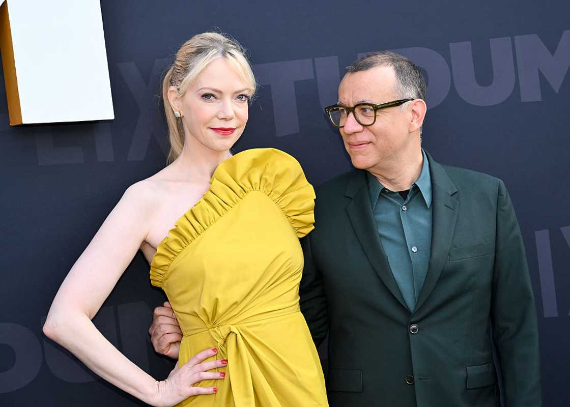 Fred Armisen is pictured looking at his wife, Riki Lindhome