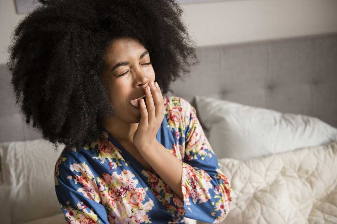 A young lady yawning