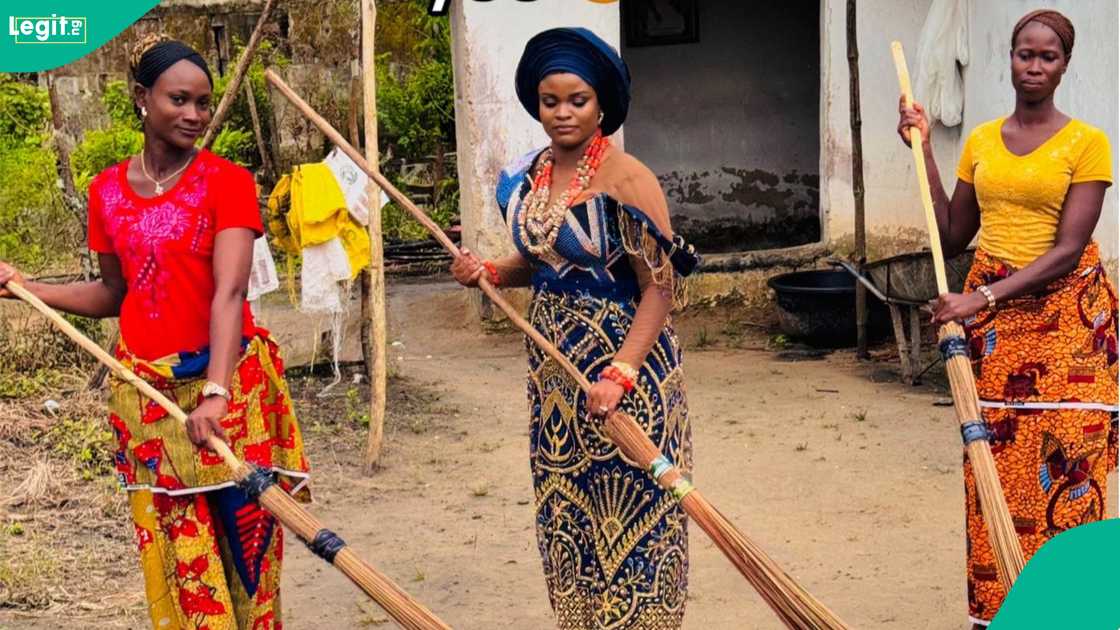 A lady shows brother’s bride sweeping family compound as part of marriage rites.