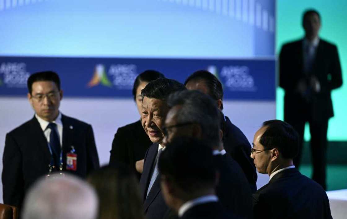Chinese President Xi Jinping (C) said officials must ensure 'comprehensive, open and transparent' legal treatment of foreign entities Chinese President Xi Jinping (C) said officials must ensure 'comprehensive, open and transparent' legal treatment of foreign entities