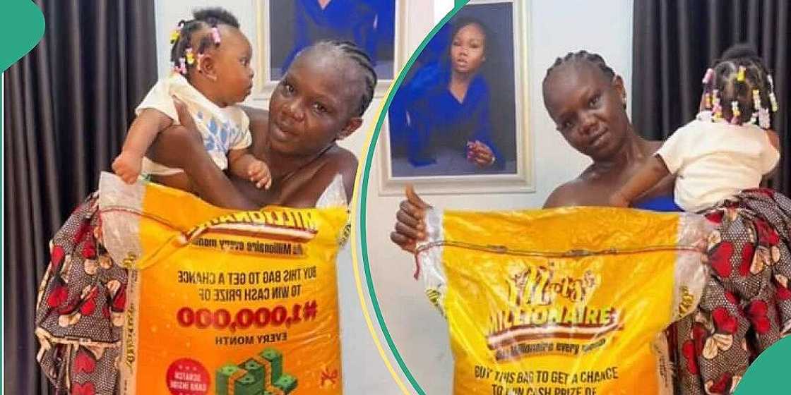 Nigerian woman poses with N75k bag of rice Nigerian woman poses with N75k bag of rice
