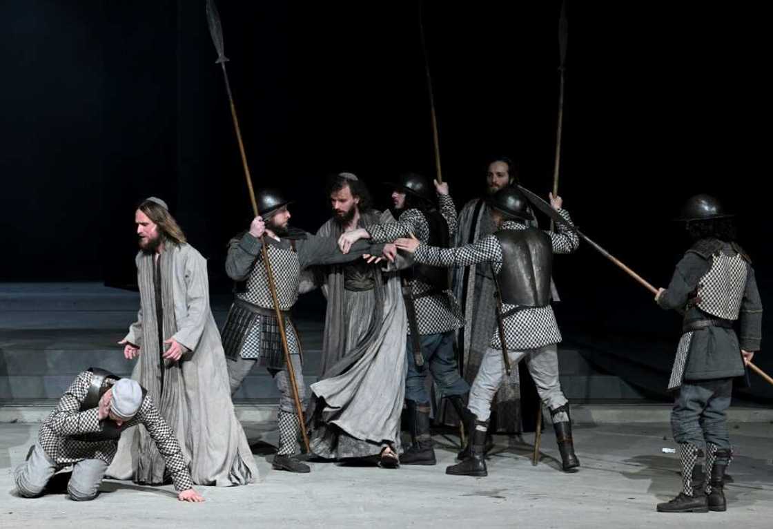 The play's themes of violence, poverty and sickness are reflected in today's world through the war in Ukraine and Covid, says Frederik Mayet (2ndL) who plays Jesus The play's themes of violence, poverty and sickness are reflected in today's world through the war in Ukraine and Covid, says Frederik Mayet (2ndL) who plays Jesus