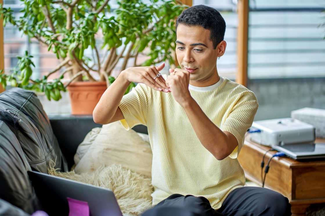 A man engaging a person on FaceTime A man engaging a person on FaceTime