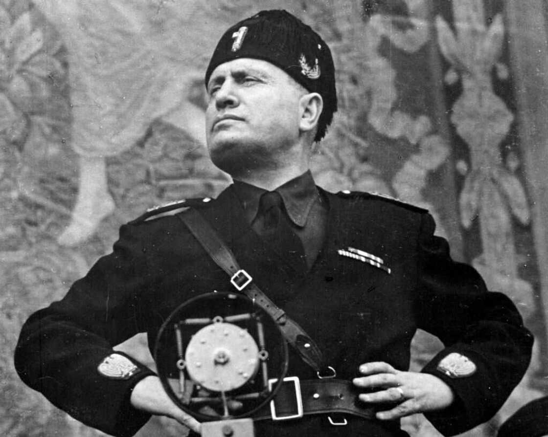 A black and white portrait of Benito Mussolini in a military uniform A black and white portrait of Benito Mussolini in a military uniform