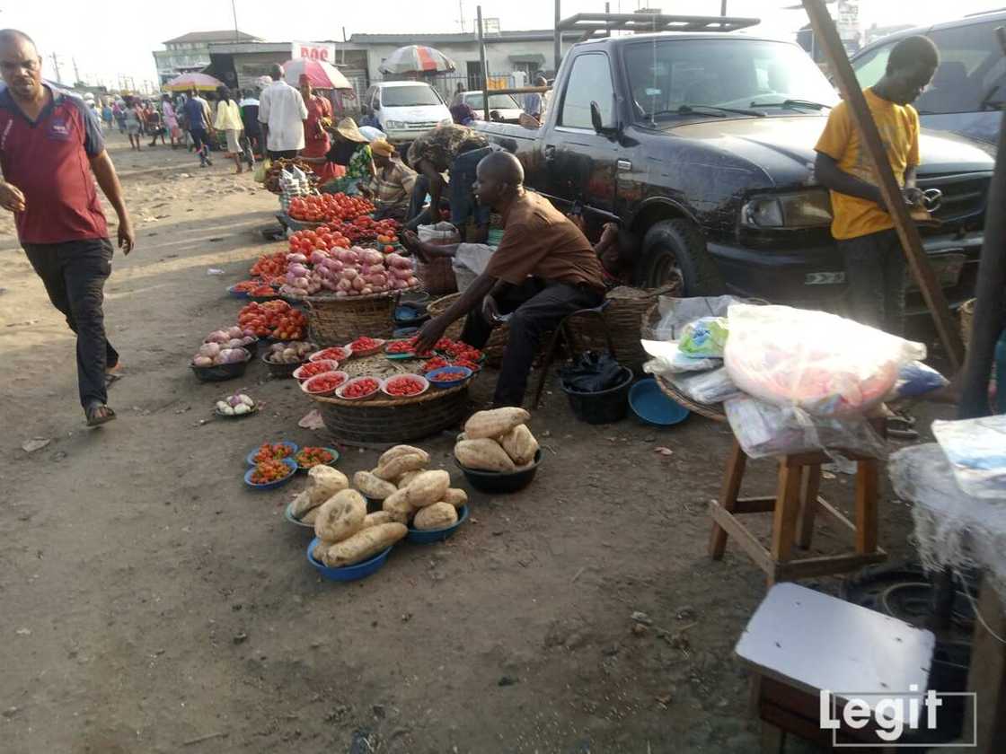 Perishable dealers at the market decry poor sales despite the affordability of goods like onion and tomatoes. Photo credit: Esther Odili