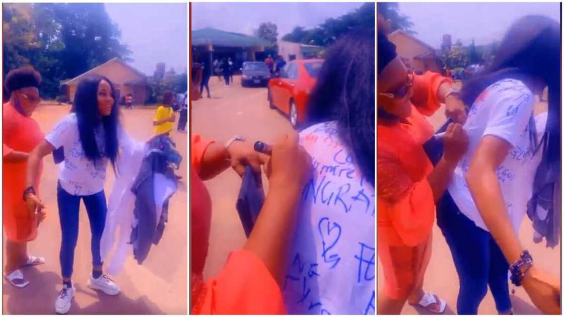 Woman decorates shirt with many signatures. Woman decorates shirt with many signatures.