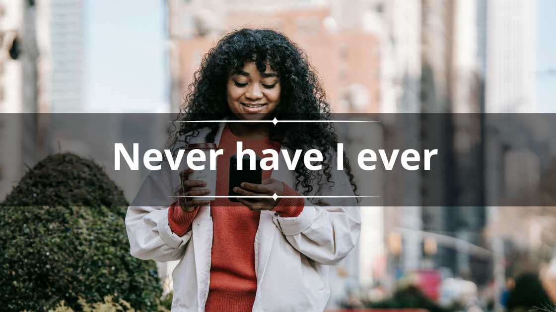 A smiling woman enjoying takeaway coffee as she uses her phone