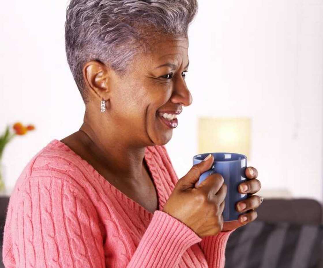 A woman drinking guava leaf tea A woman drinking guava leaf tea