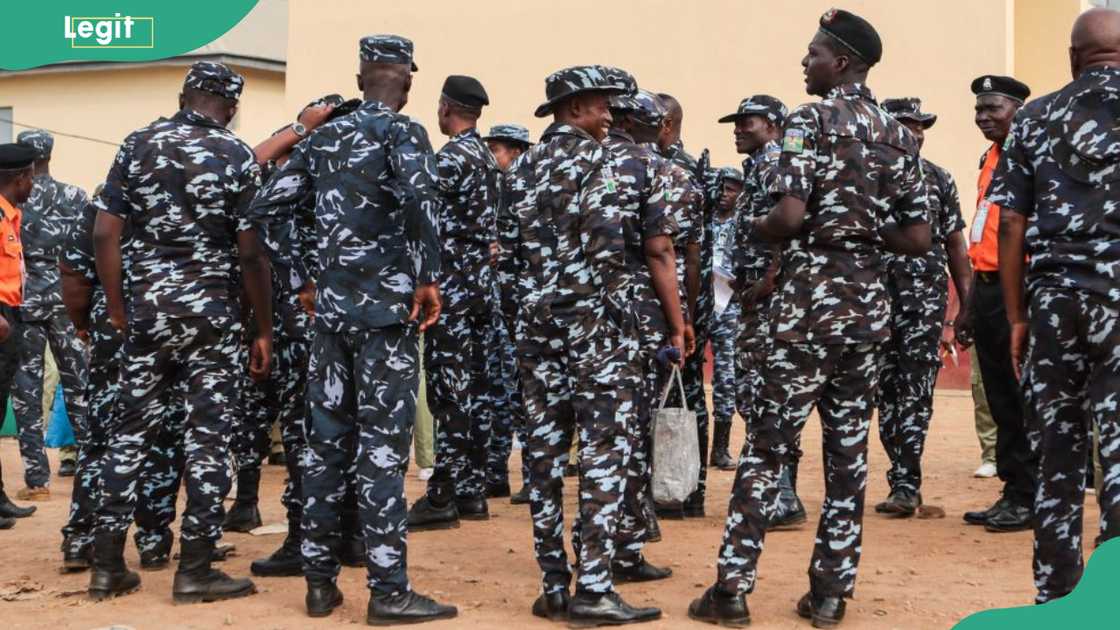 Police officers prepare to go to different polling stations in Ibadan before polls open during Nigeria's presidential and general election