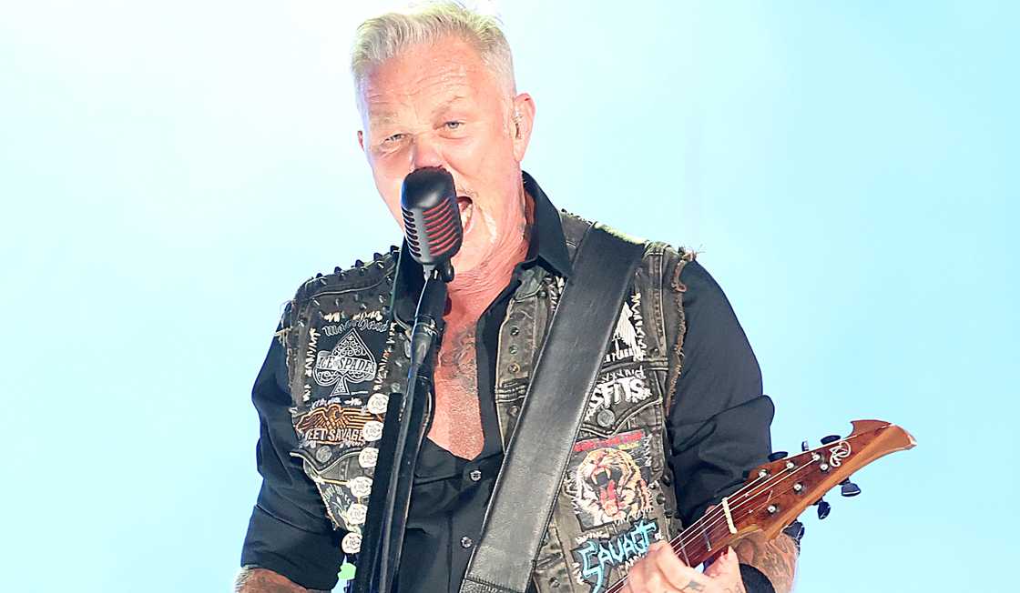 James Hetfield of Metallica performs against a blue background.