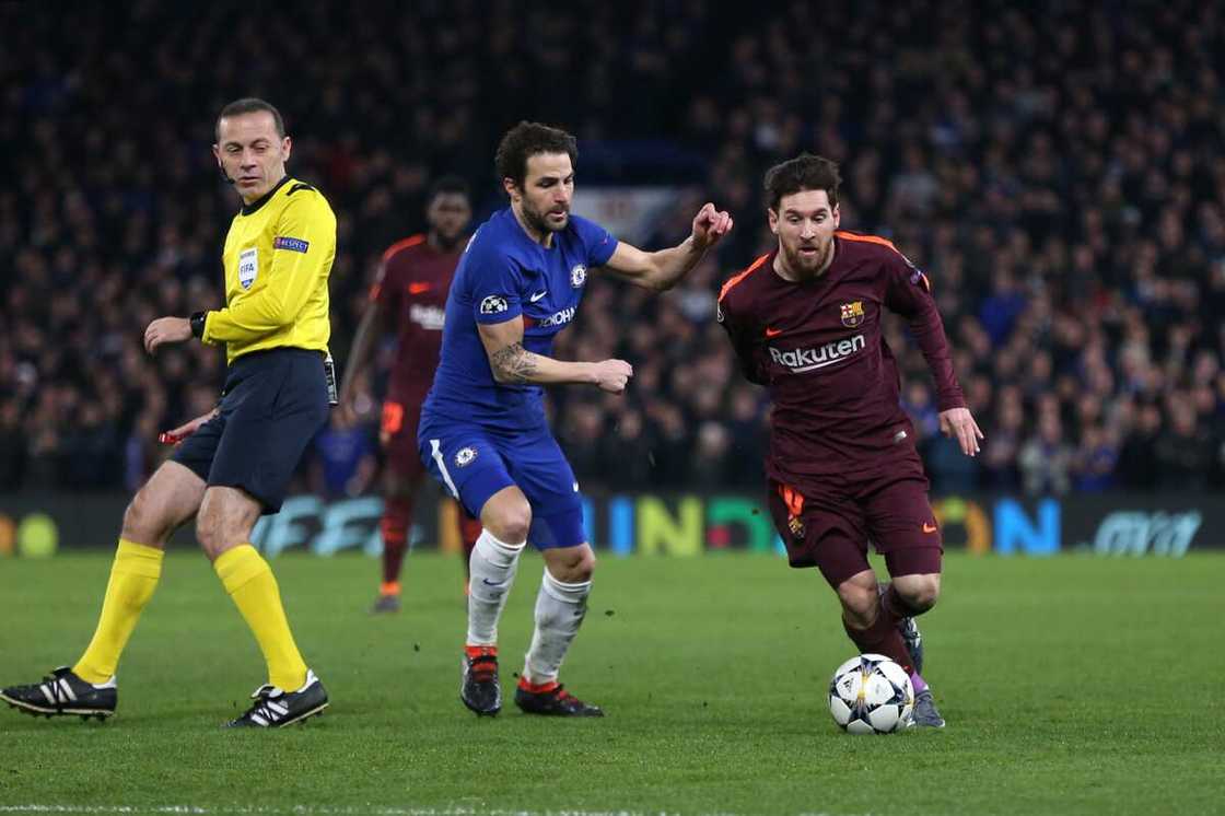 Cesc Fabregas and Lionel Messi. Cesc Fabregas and Lionel Messi.