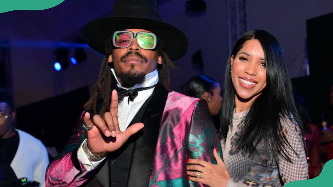 Cam Newton and Jasmin Brown attend an event