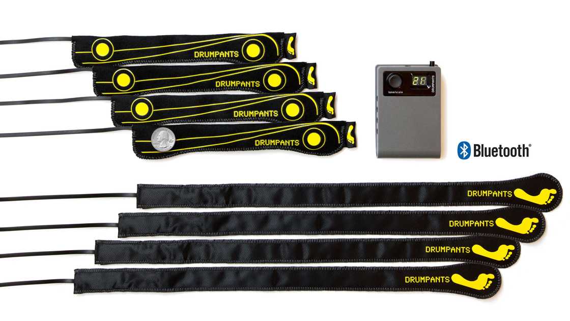 A DrumPants control box, eight wearable drum pad and foot pedal sensor strips. A DrumPants control box, eight wearable drum pad and foot pedal sensor strips.
