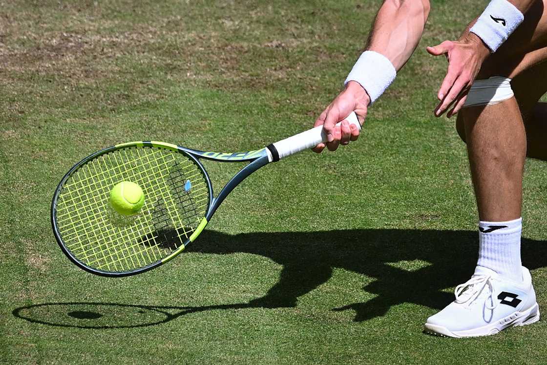 Hungary's Fabian Marozsan returns the ball to the US' Taylor Fritz during their men's singles match