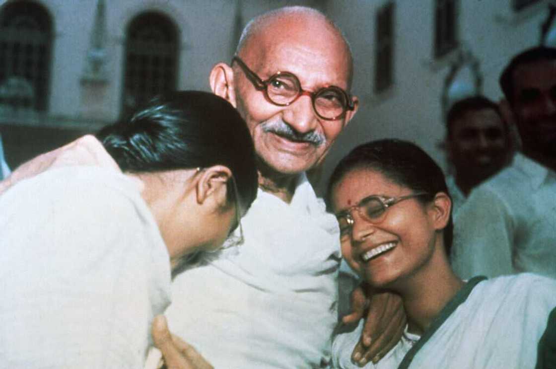 Mahatma Gandhi enjoys a laugh with his two granddaughters Mahatma Gandhi enjoys a laugh with his two granddaughters
