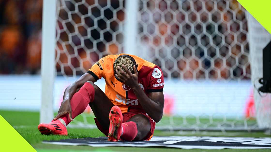 Victor Osimhen looks dejected after suffering an injury