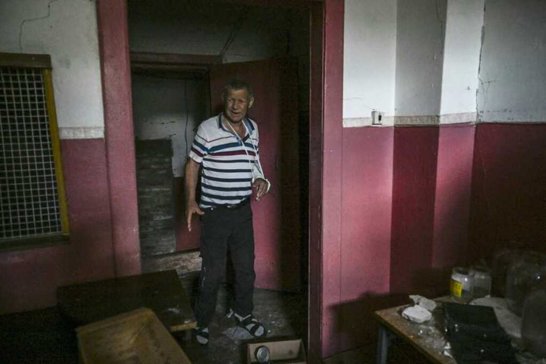 Mykhailo Chindey's injured arm is encased in plaster, a painful reminder of Russia's occupation Mykhailo Chindey's injured arm is encased in plaster, a painful reminder of Russia's occupation
