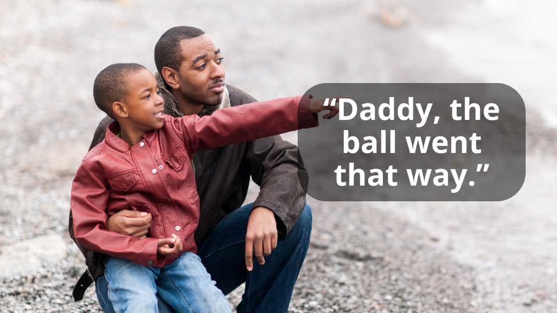 A father and son pointing at something