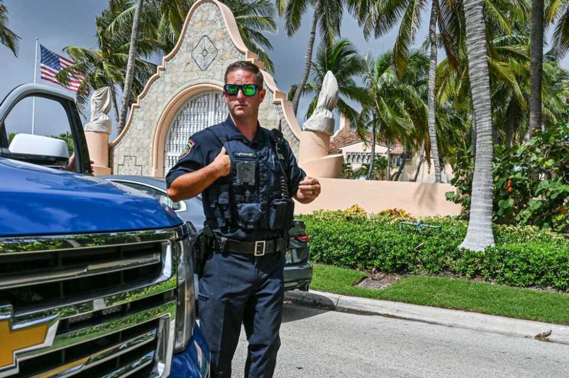 Local law enforcement officers are seen in front of the home of former President Donald Trump at Mar-A-Lago in Palm Beach, Florida on August 9, 2022 Local law enforcement officers are seen in front of the home of former President Donald Trump at Mar-A-Lago in Palm Beach, Florida on August 9, 2022