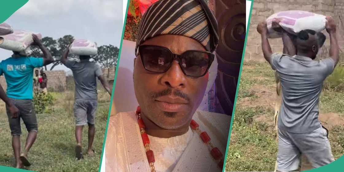 Ibrahim Chatta carries bag of cement on his head. Ibrahim Chatta carries bag of cement on his head.