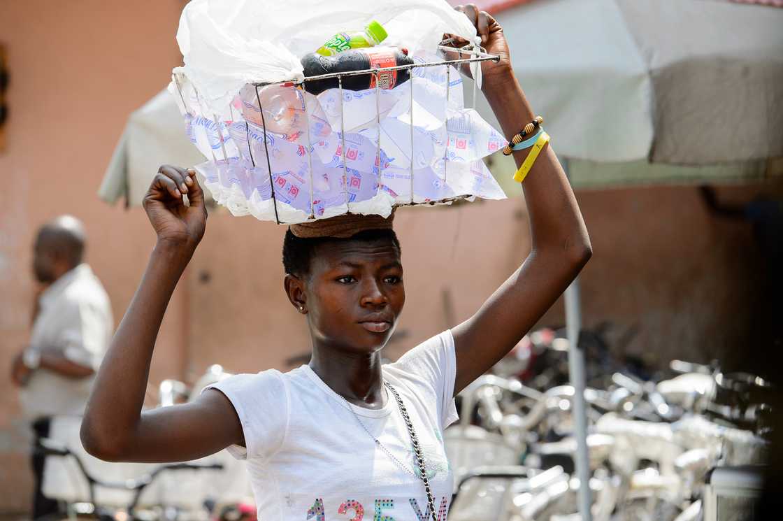 A lady is selling satchet water
