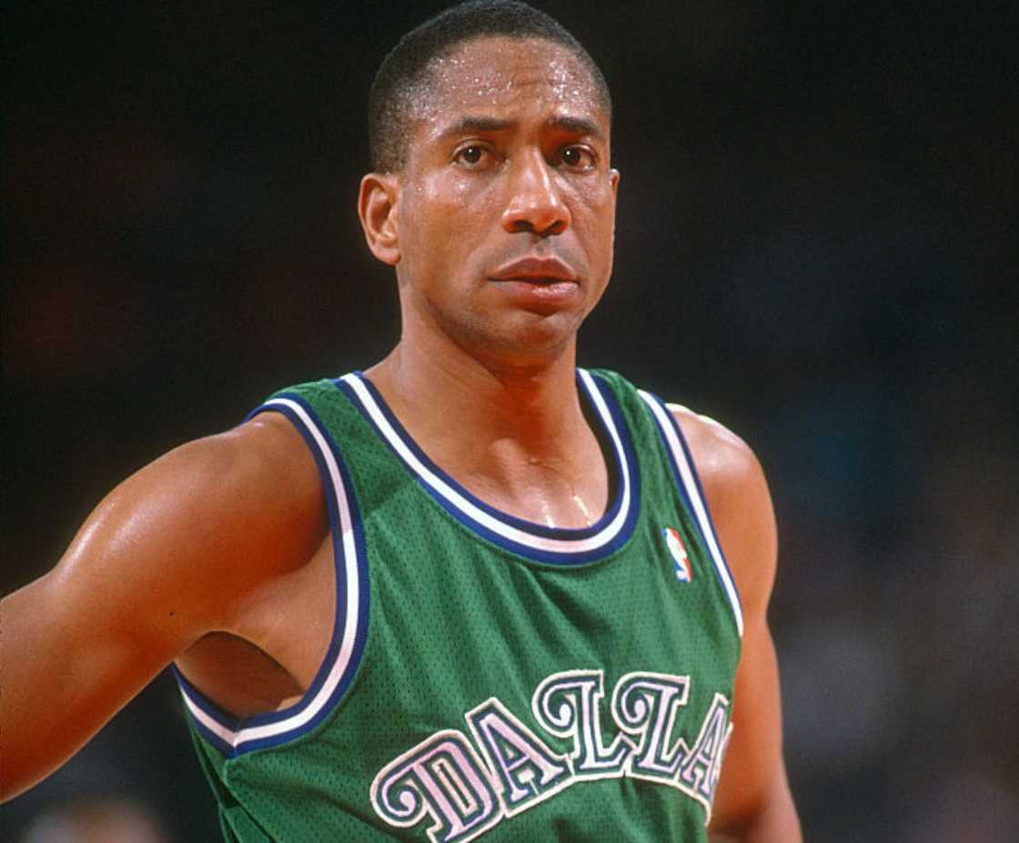 Alex English looks on against the Washington Bullets during an NBA basketball game Alex English looks on against the Washington Bullets during an NBA basketball game