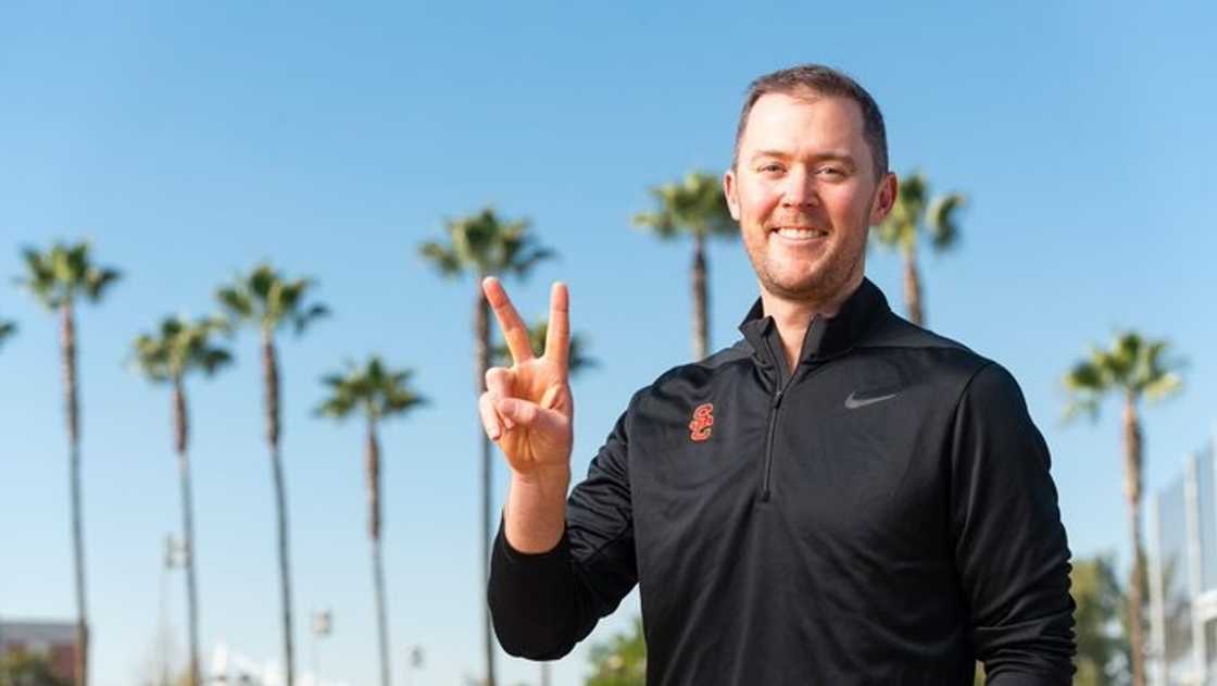 Lincoln Riley gestures in a portrait