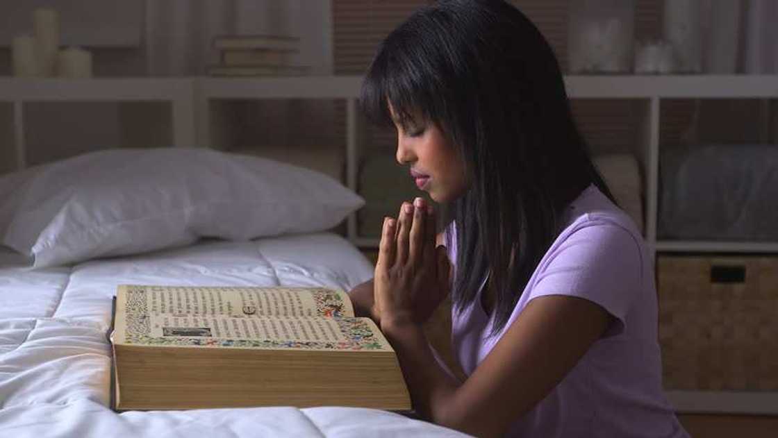 A woman is praying A woman is praying